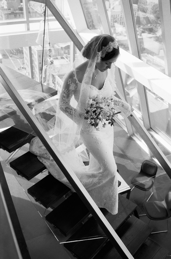 photo by New York City based wedding photographer Karen Hill - beautiful bride walking down stairs 